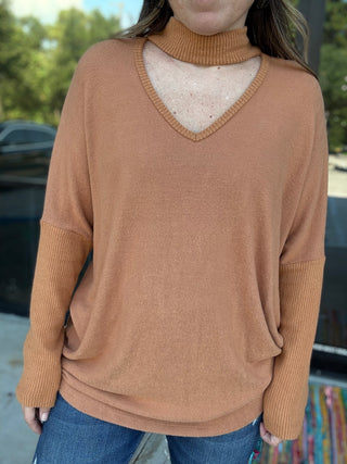 woman wearing brown long sleeve sweater outside- ava wray boutique
