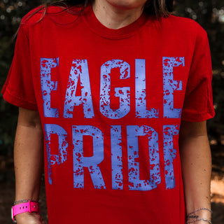 Red t-shirt with blue 'Eagle Pride' text worn by a person-ava wray boutique