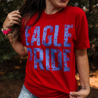 Person wearing a red t-shirt with 'Eagle Pride' printed in blue-ava wray boutique