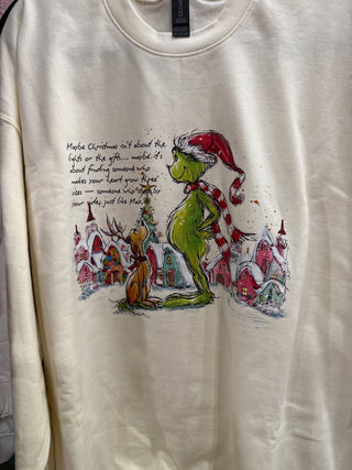 White shirt with a colorful graphic of a character and text on a plain background